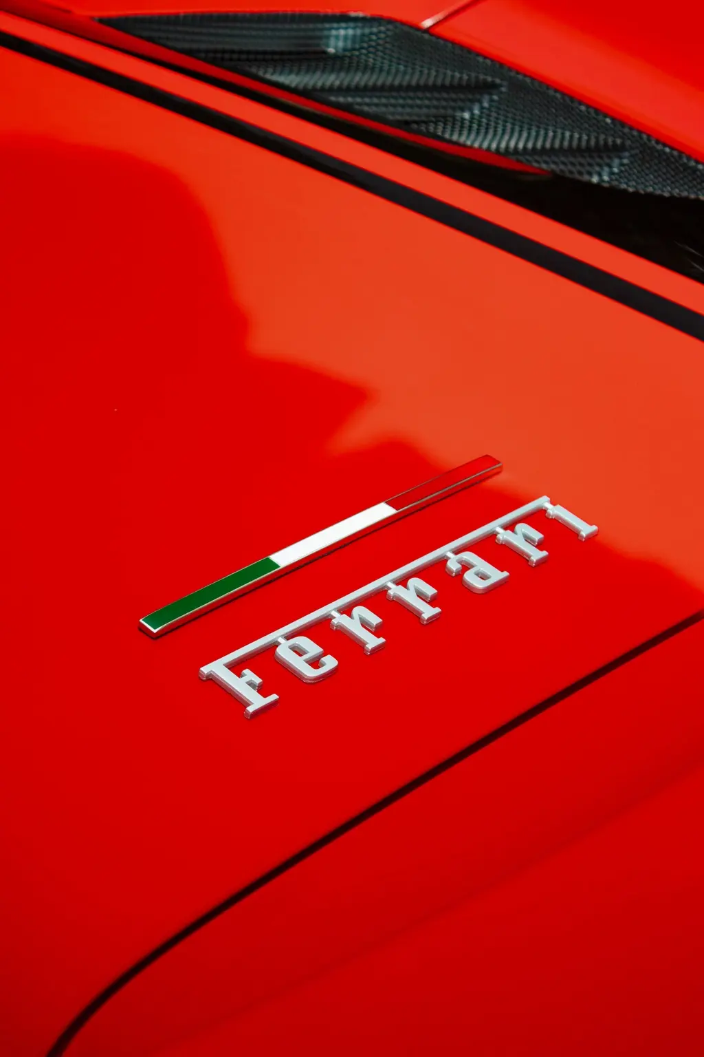 Ferrari script on red bodywork