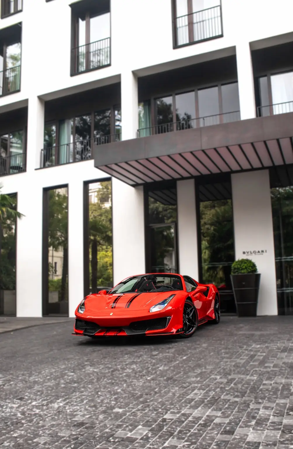 Ferrari arriving at Bulgari Hotel Milano