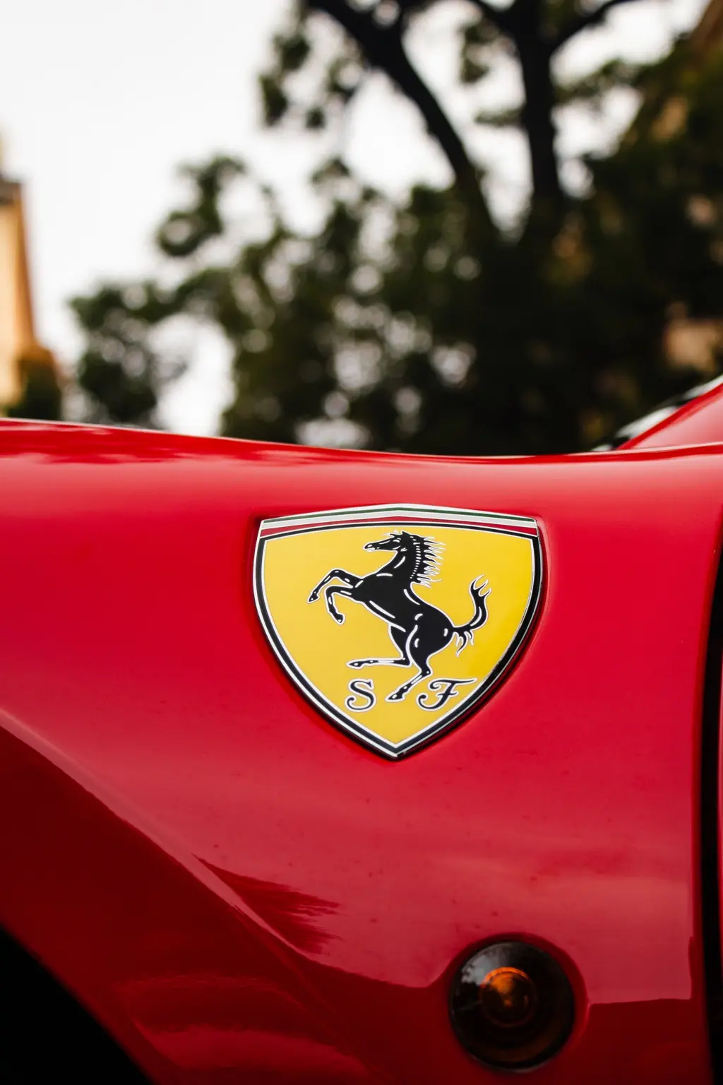 Ferrari shield on red bodywork