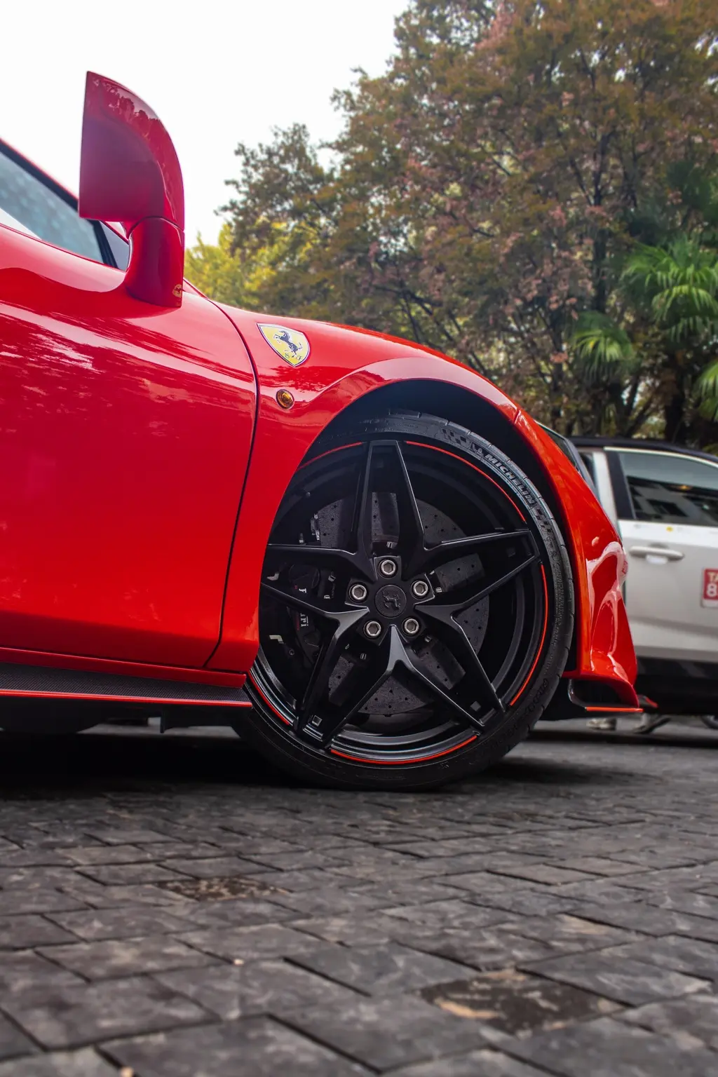 Ferrari wheel and carbon ceramic brake detail