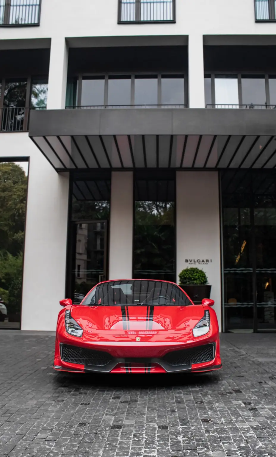 Ferrari in front of the hotel entrance