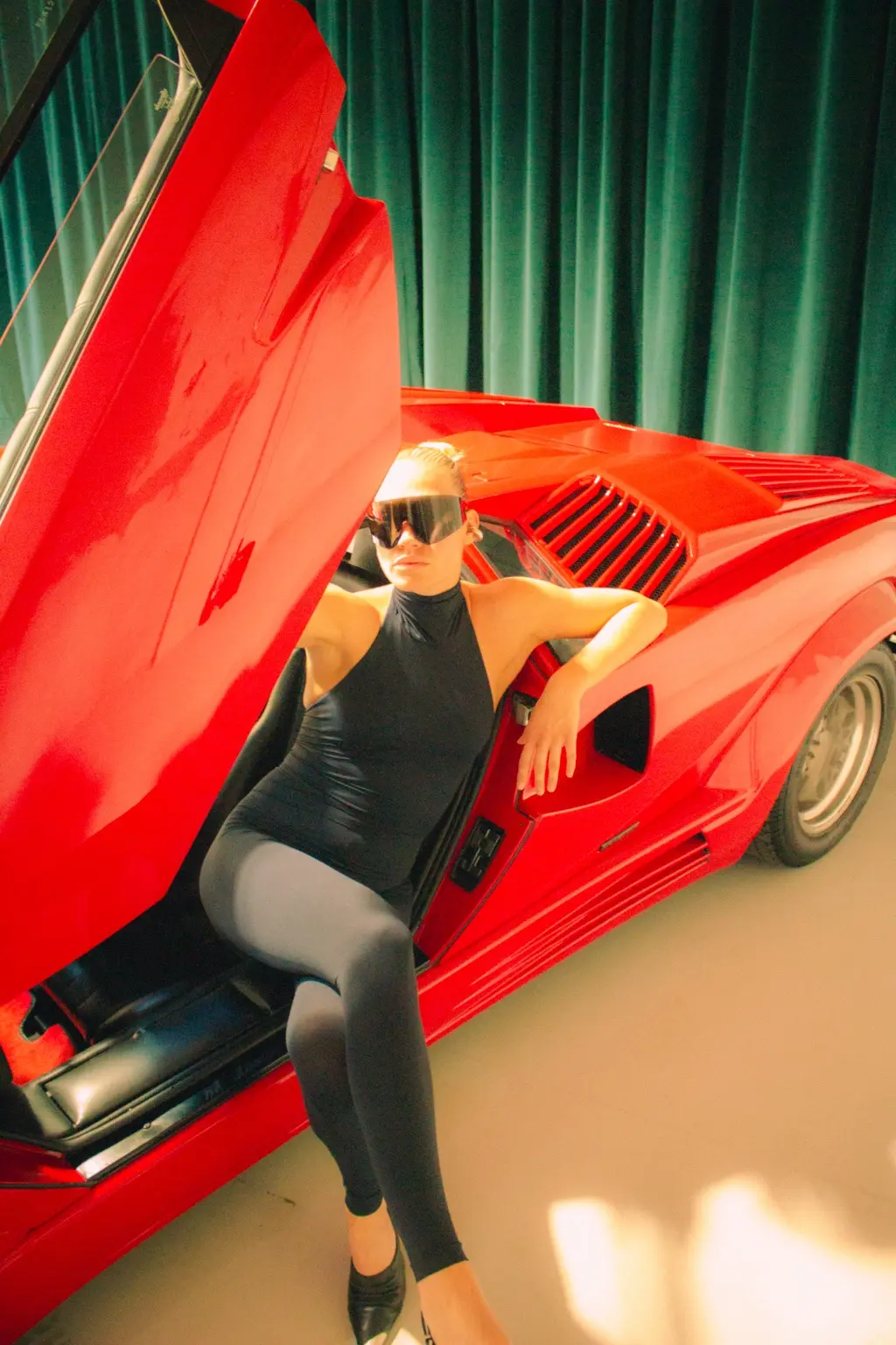 Alyona posing in the Countach doorway