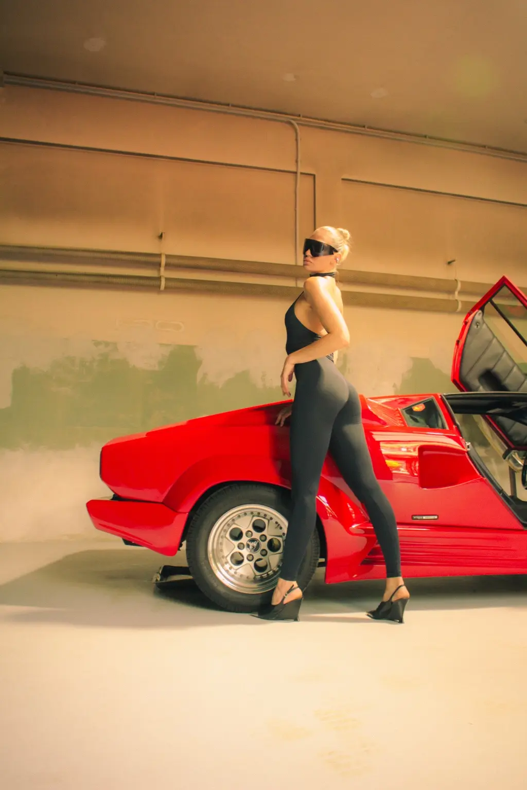 Profile portrait beside the Countach