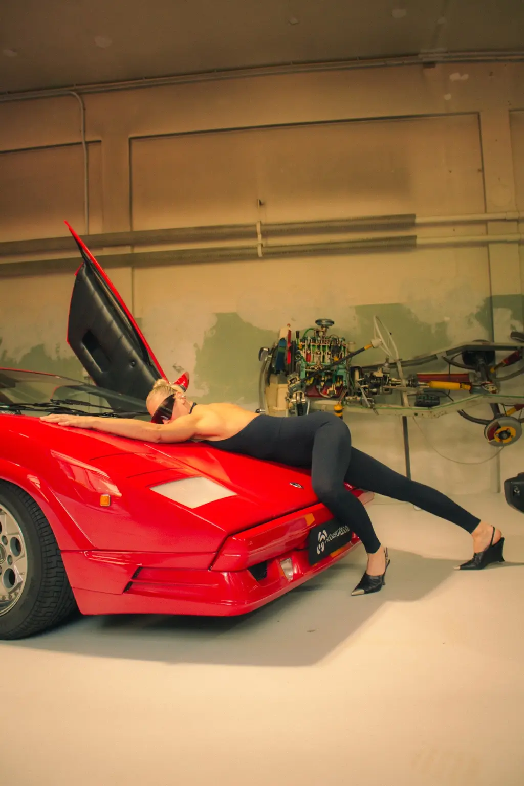Alyona across the angular Countach bonnet