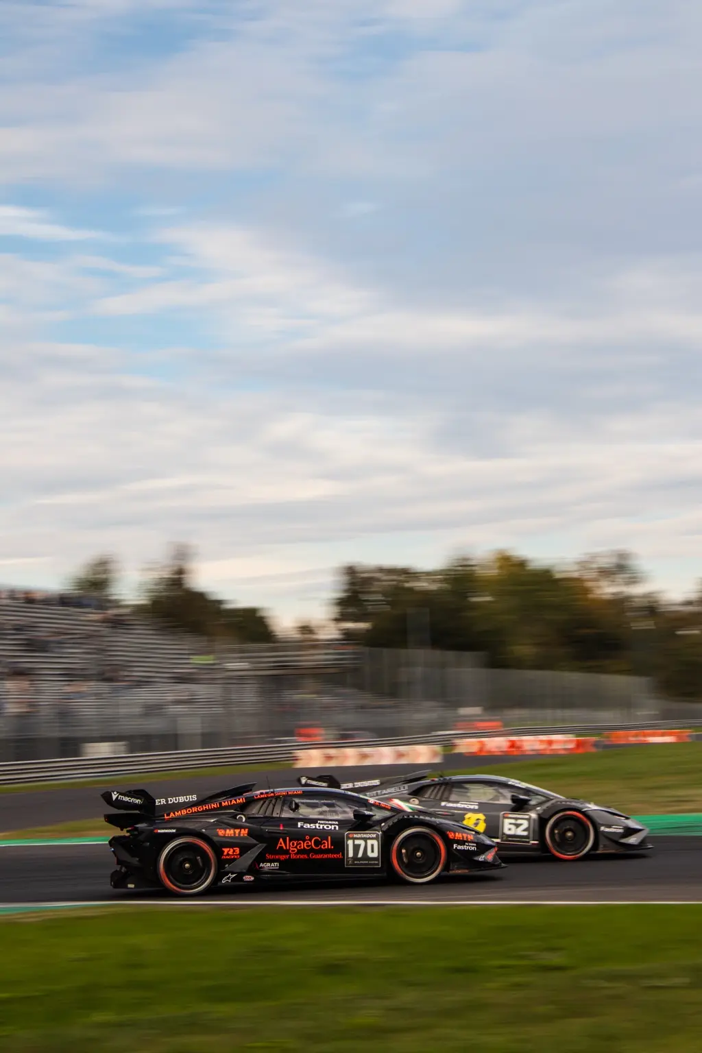 Two Lamborghini Huracán race cars running side by side